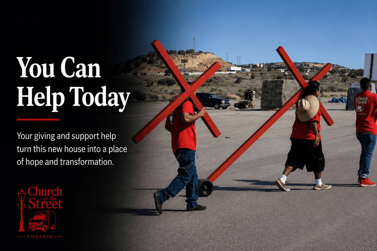 Two men in red shirts carry large red wooden crosses across a paved lot outdoors.